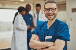 Happy optimistic young hospital surgeon